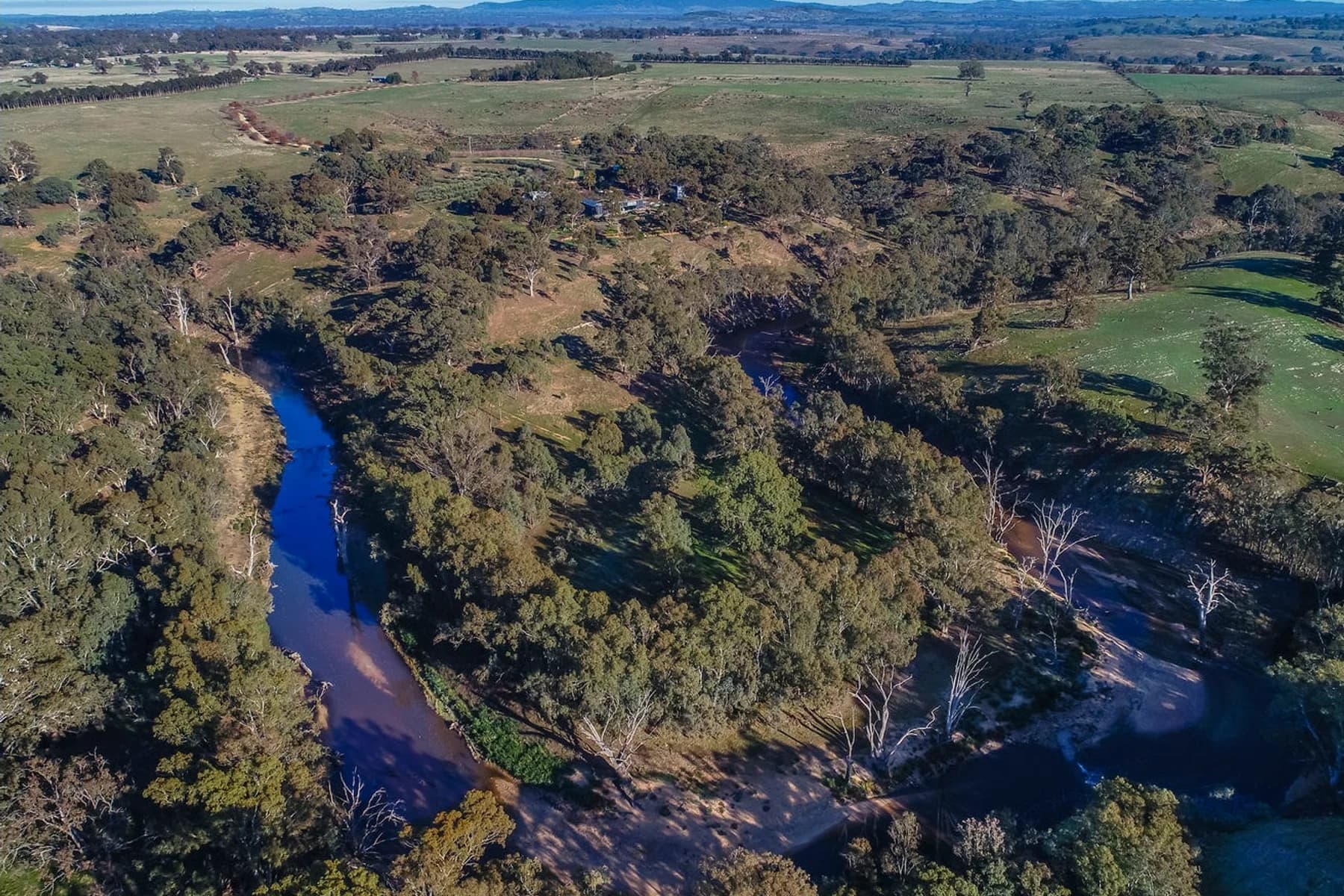 The Campaspe River winding through mature gums at Stone Axe