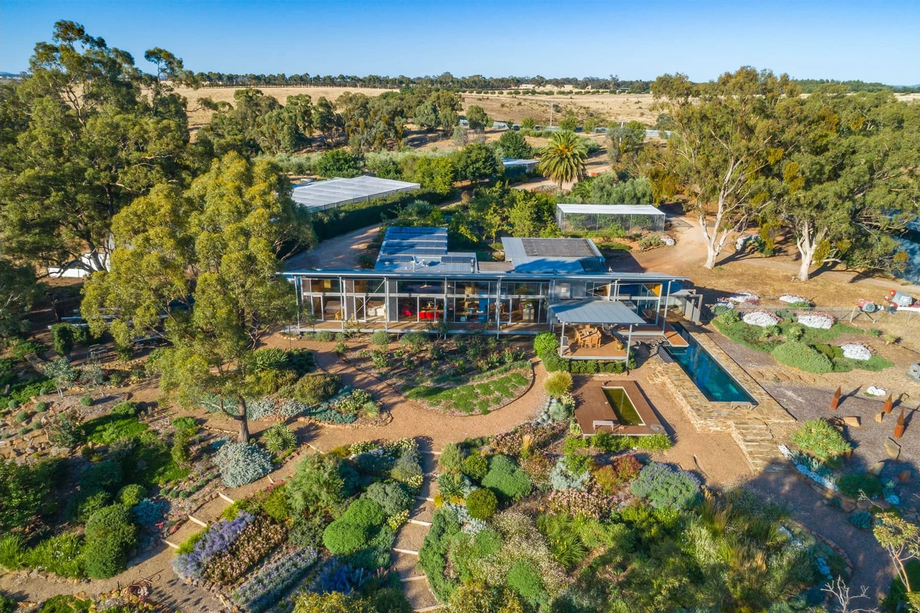 The Main House, pool and established garden viewed from above