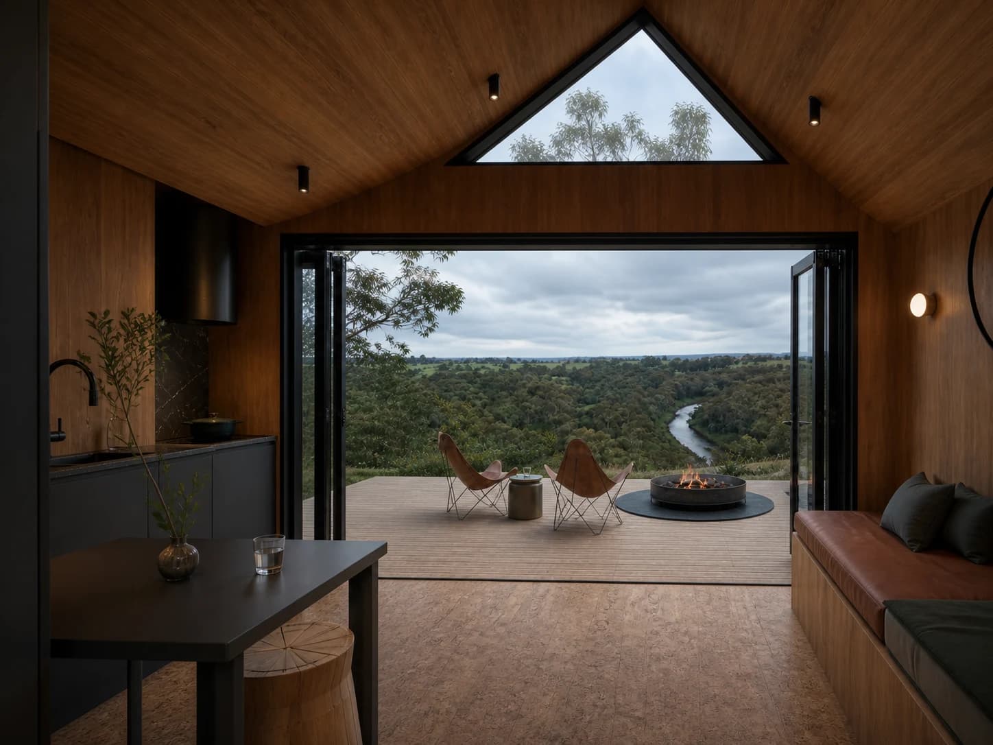 Concept rendering of the Tiny House One living area and kitchen opening to the river view