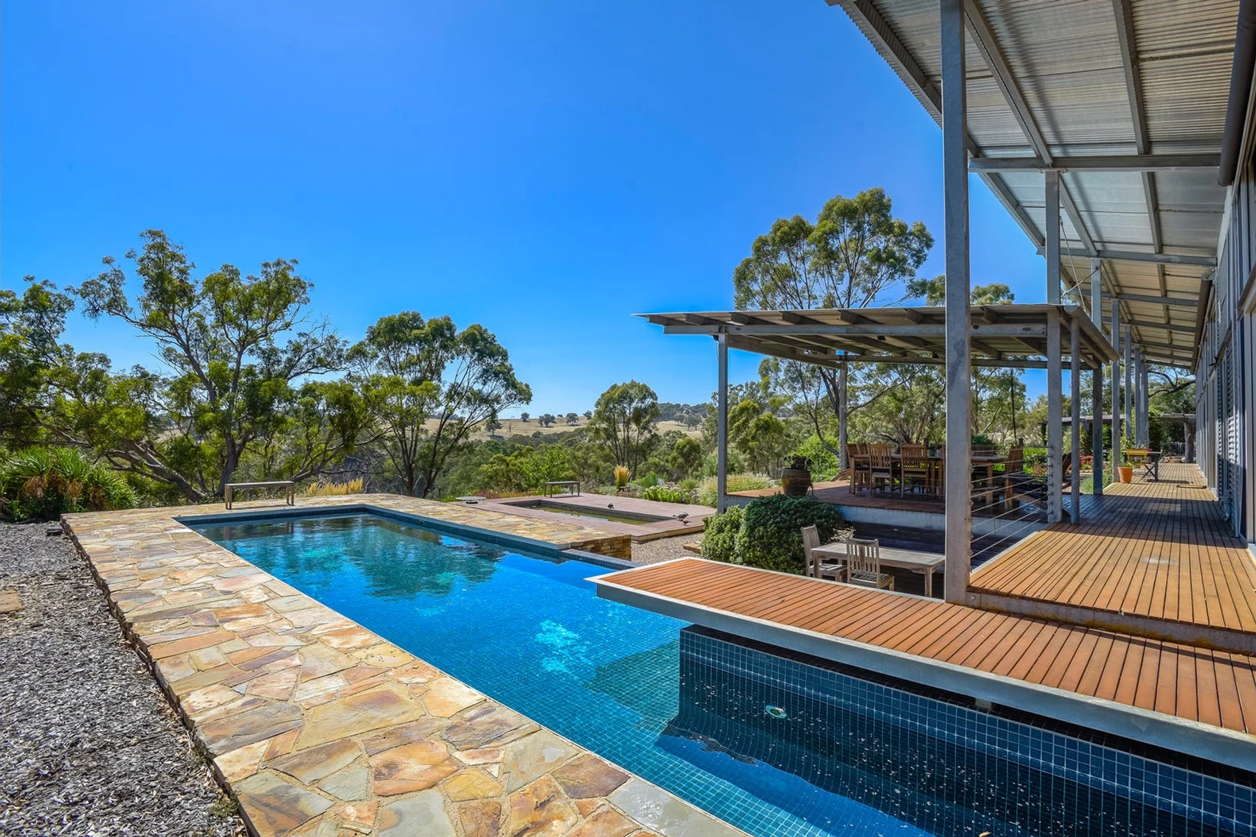 The Stone Axe Main House pool and deck overlooking the property